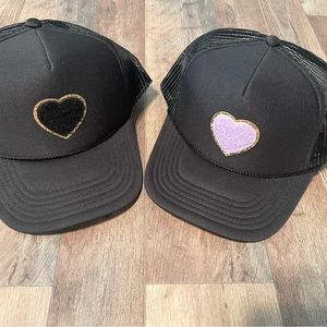 Adjustable mesh back. Trucker hat with chenille heart patch